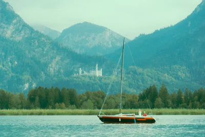 Neuschwanstein Castle Alpine Lake Sailing - free wallpaper 6000×4000