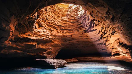 Underground Cave With Turquoise Pool and Golden Rock Formation - free landscapes wallpaper 1920×1080