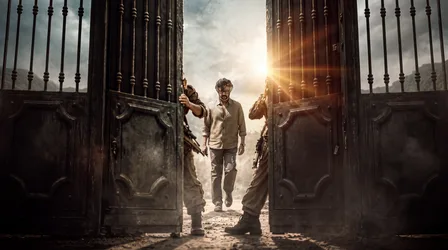 Man Walking Through Ornate Iron Gates at Sunset - free wallpaper 5504×3072