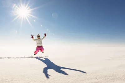Child Jumping on Snowy Landscape Under Bright Sun - free people & portraits wallpaper 5905×3942