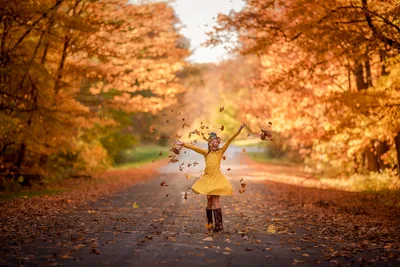 Girl in Yellow Dress Playing in Autumn Leaves - free wallpaper 6016×4016