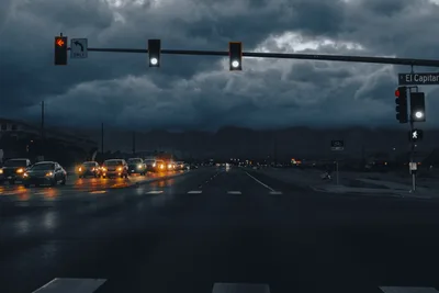 Rainy Urban Intersection with Traffic Lights and Cars - free wallpaper 7680×5120