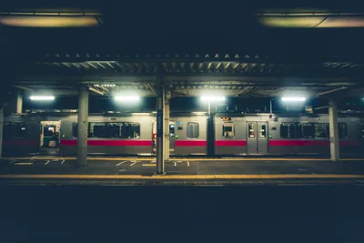 Train Station Platform At Night With Red And White Train - free wallpaper 7680×5123
