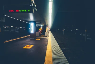 Empty Japanese Train Platform at Night with Departure Board - free city & urban wallpaper 7680×5123