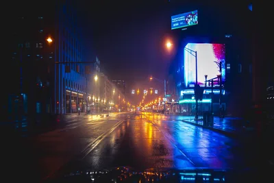 Neon-Lit Urban Street at Night with Wet Pavement - free wallpaper 7680×5123
