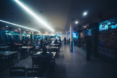 Modern Food Court at Night with Blue Neon Lighting - free city & urban wallpaper 7680×5123