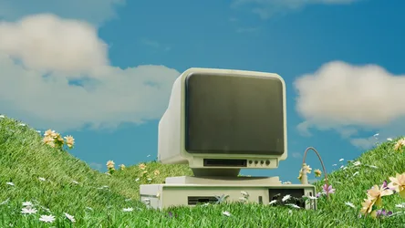 Retro CRT Monitor in a Blooming Meadow - free technology wallpaper 1920×1080