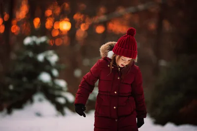 Child in Red Winter Coat Among Snowy Trees at Dusk - free wallpaper 6016×4016