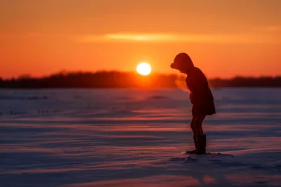 Child Standing on Frozen Lake at Sunset - free wallpaper 5761×3846