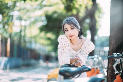 Woman in White Lace by Bicycle on Tree-Lined Path - free people & portraits wallpaper 4000×2667