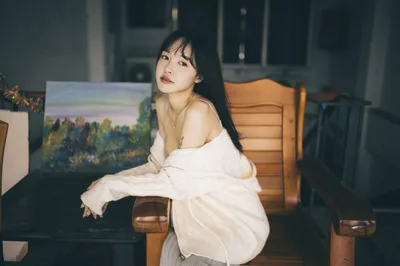 Woman in White Shirt Seated by Wooden Chair - free people & portraits wallpaper 4000×2658