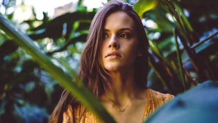 Woman Among Green Foliage in Golden Sunlight - free wallpaper 2738×1540