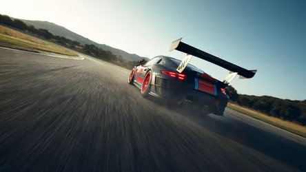 High-Performance Race Car on Mountain Road - free cars & vehicles wallpaper 7680×4328