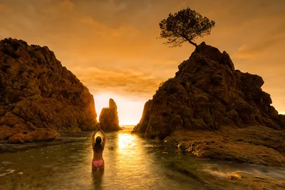 Woman in Water at Sunset Between Rock Formations - free people & portraits wallpaper 2048×1365