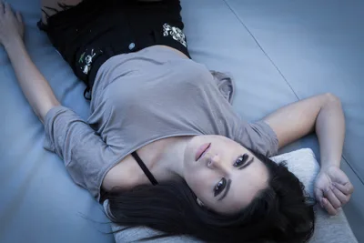 Woman Lying on Blue Surface Looking Upward - free wallpaper 5184×3456