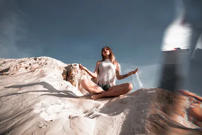 Woman in White Fringe Top Posing on Desert Rocks - free wallpaper 2560×1707