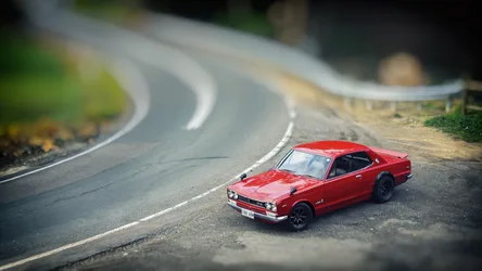 Red Toy Car on Curved Road Miniature Scene - free cars & vehicles wallpaper 1920×1080