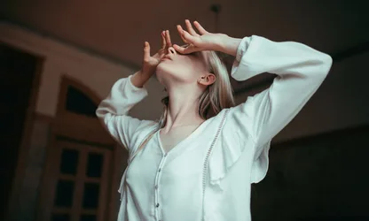 Woman in White Shirt Looking Upward Indoors - free wallpaper 2048×1232