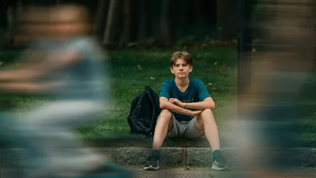 Young Boy Sitting on Stone Ledge in Park - free people & portraits wallpaper 6144×3456
