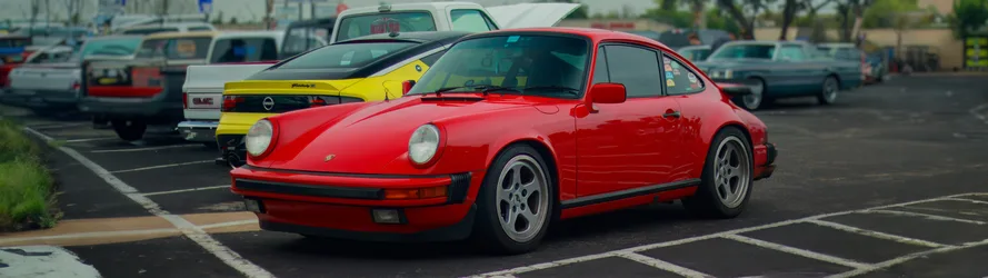 Red Porsche 911 in Parking Lot - free wallpaper 5120×1440