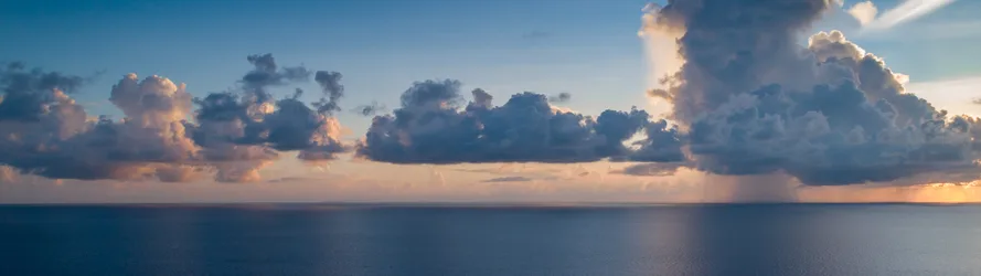 Serene Ocean Horizon at Sunset - free wallpaper 5120×1440