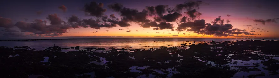 Twilight Seascape with Rocky Shores and Dramatic Clouds - free wallpaper 7815×2198