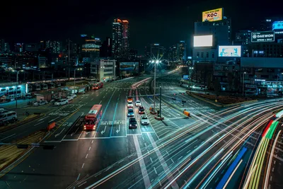 Night City Intersection with Light Trail Traffic - free city & urban wallpaper 7680×5123