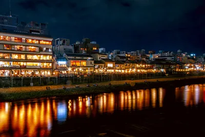 Illuminated Riverside District at Dusk in Japan - free city & urban wallpaper 7680×5119