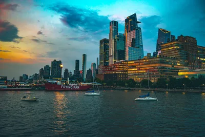 Manhattan Skyline at Dusk with Harbor Boats - free city & urban wallpaper 7680×5126