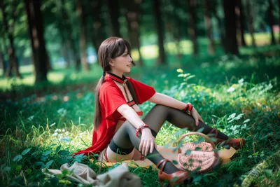 Girl in Red Shirt Sitting in Forest Clearing - free wallpaper 7680×5118