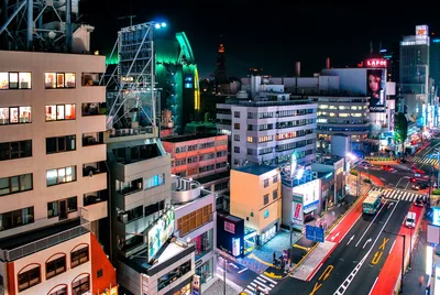 Vibrant Neon-Lit Urban Intersection at Night - free wallpaper 7680×5141
