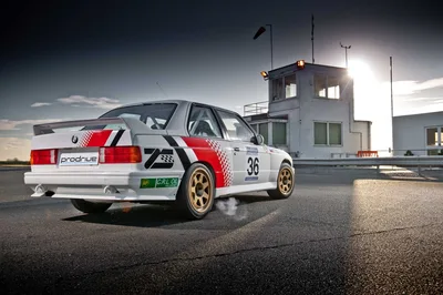 BMW E30 M3 Race Car at Airfield Control Tower - free wallpaper 7680×5112
