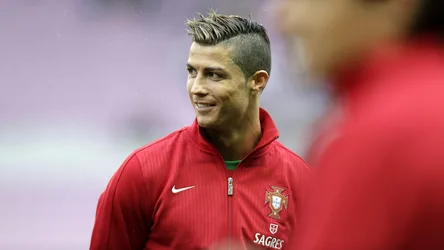 Cristiano Ronaldo in Portugal National Team Red Jacket - free wallpaper 5120×2880