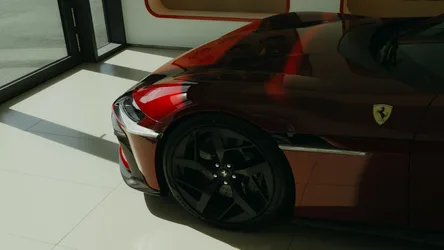 Ferrari Red Supercar in Showroom - free wallpaper 4000×2250