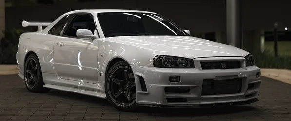 Nissan Skyline White Performance Coupe at Night - free wallpaper 3440×1440