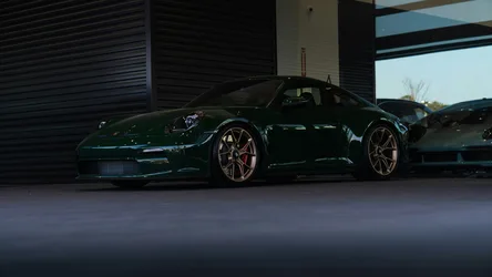 Green Porsche Sports Car in Modern Garage - free cars & vehicles wallpaper 6887×3876