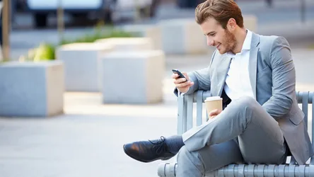 Man in Suit Smiling While Using Phone Outdoors - free people & portraits wallpaper 2200×1238