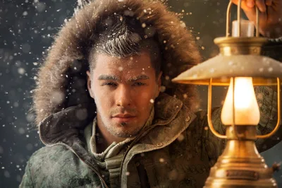 Man Portrait in Winter Coat with Golden Lantern in Snow - free people & portraits wallpaper 7680×5111