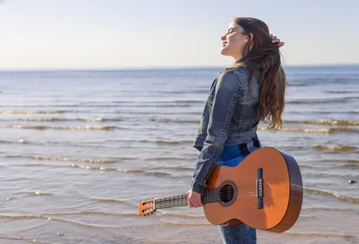 Woman with Guitar on Beach Shore at Sunset - free people & portraits wallpaper 2000×1361