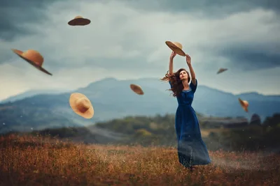 Woman in Blue Dress Juggling Hats in Mountain Field - free people & portraits wallpaper 2000×1333