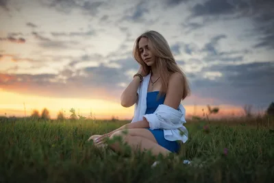 Beautiful Girl in Blue Dress Posing in Summer Field at Sunset - free wallpaper 7680×5128