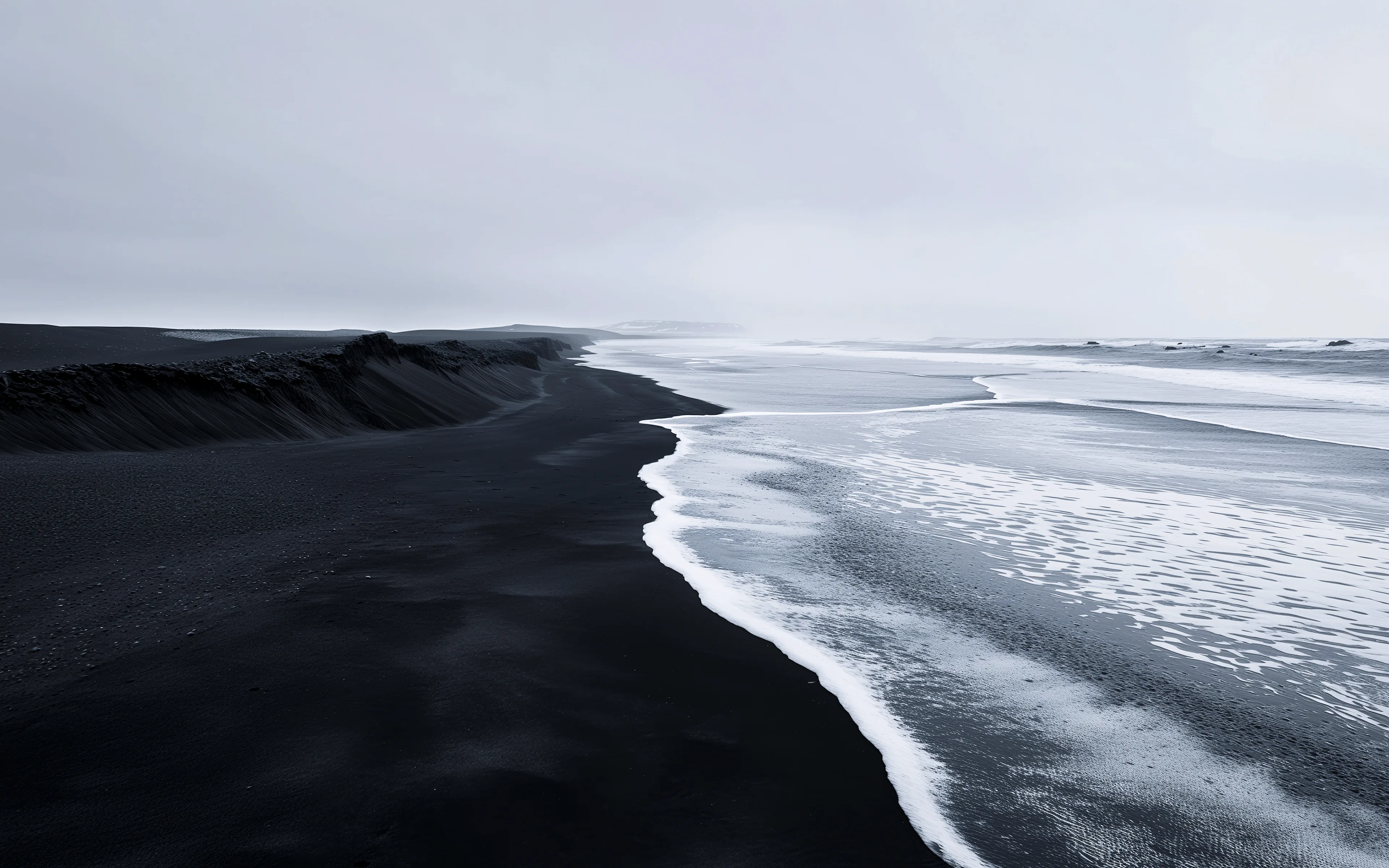 Dark Shores: Where Waves Meet Black Sand